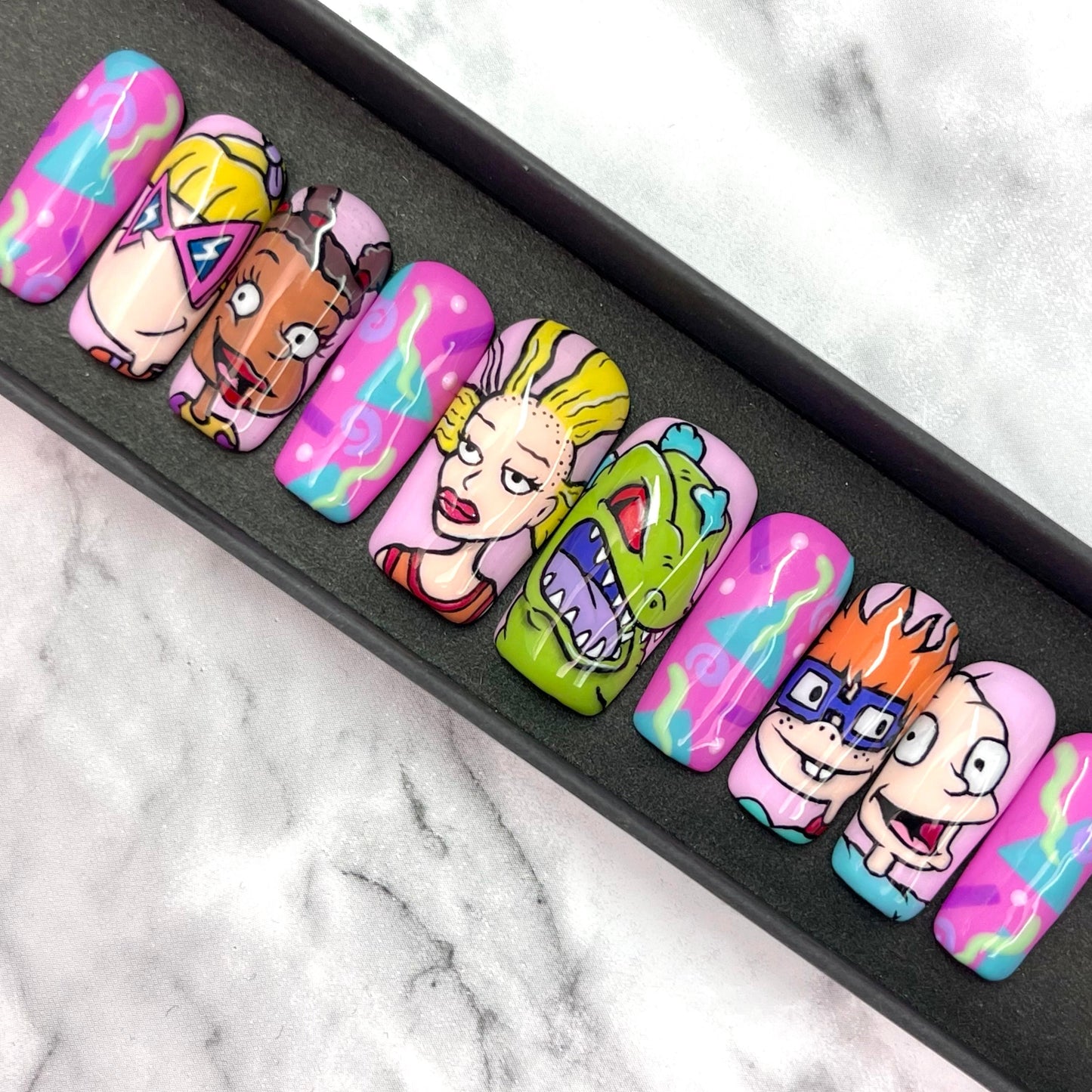 Hand painted Rugrats inspired press on nails set in a black gift box