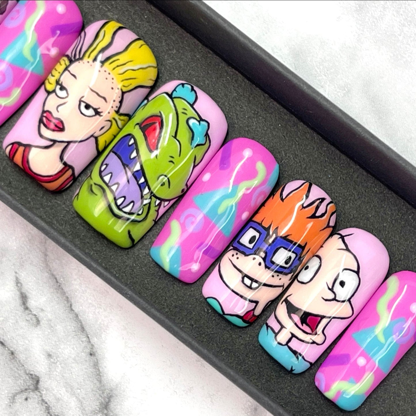 Hand painted rugrats press on nails with chucky, tommy, reptar and cynthia